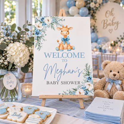 Blue giraffe baby shower sign displayed on tabletop wooden easel