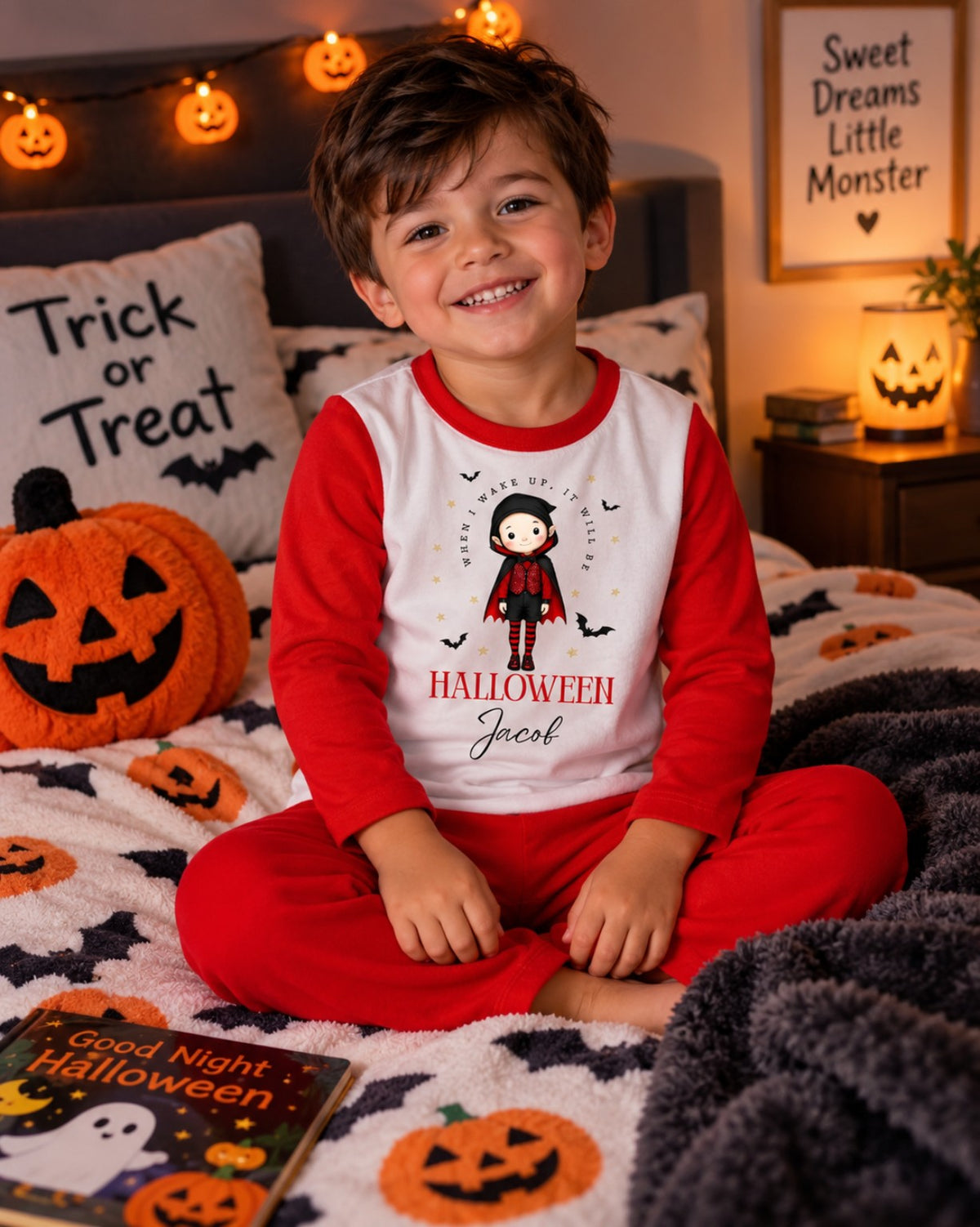 Boy wearing personalised red and white Halloween pyjamas