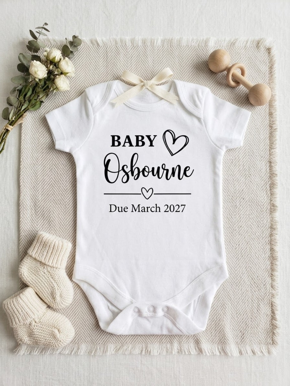 Personalised baby announcement vest with surname and due date