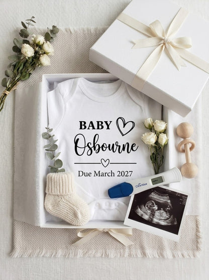 Personalised pregnancy announcement baby vest displayed in gift box